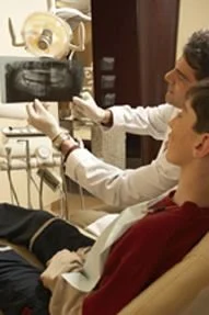 Wentzville dentist reviewing digital X-rays with a patient to discuss a personalized treatment plan