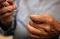 Close-up of a person flossing to demonstrate daily oral hygiene and gum health